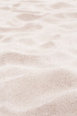 Fine Sand texture natural view. Close up of sand on shore sea, white waves dunes, pink neutral...