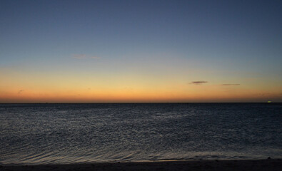 a sunset on the island of Aruba in the caribbean sea