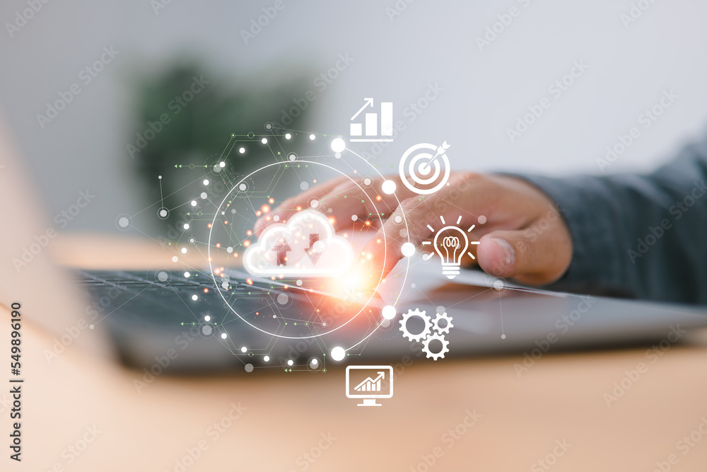 Poster Hand-touching virtual cloud computing on a laptop with world and technology items such as uploading and downloading Cloud technology management and big data include business strategy, customer service
