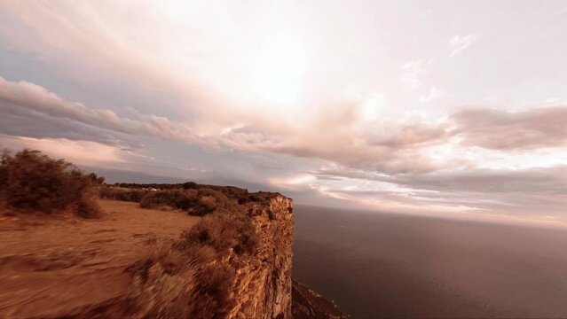 FPV aerial view of a huge cliff that meets the mediterranean sea in Southern france.
