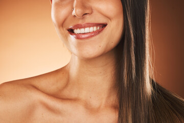 Obraz premium Happy, smile and woman with hair care, skincare and beauty cosmetic treatment in a studio. Happiness, health and girl model with a wellness facial skin routine isolated by a gradient brown background