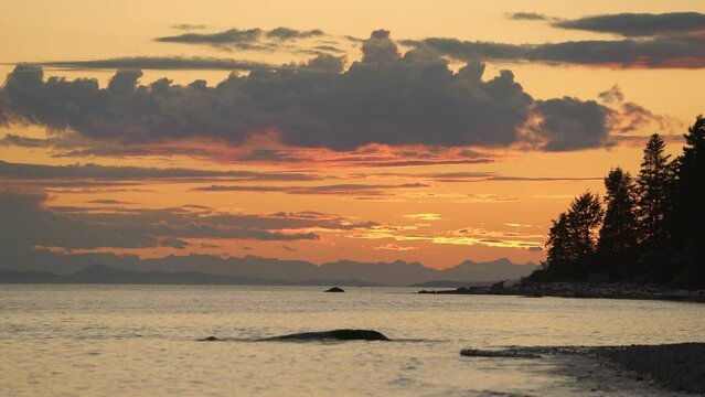 Sunshine Coast Salish Sea Sunset 4K UHD. Salish Sea shore at sunset on the Sunshine Coast near Sechelt. BC, Canada. 4K UHD.
