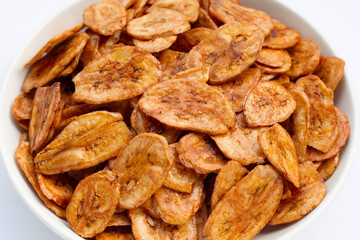 Banana chips on white background.