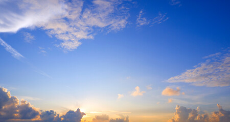 Sunset sky clouds background with bright colorful yellow sunlight in the morning