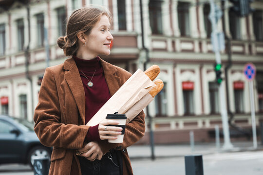 beautiful girl with baguettes and coffee