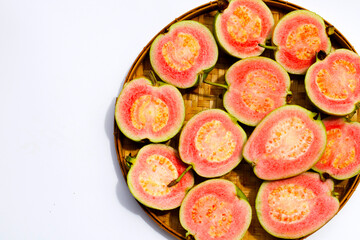 Fresh pink guava on white background.