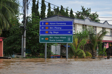 a signboard in a flooded town