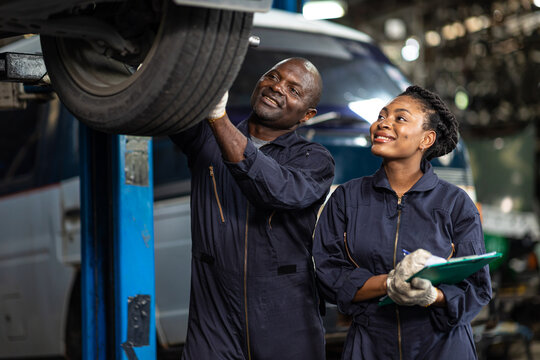 garage mechanic team working car auto service black african people professional worker together