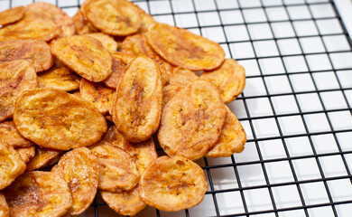 Banana chips on white background