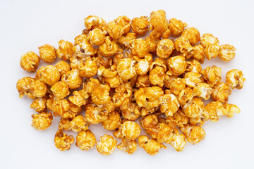 Honey caramel popcorn on white background.