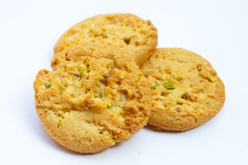 Pistachio and almond cookies on white background.