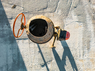 Industrial concrete mixer at a construction site. Mixing concrete and mortar on site. construction equipment. View from above.