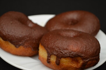 Beautiful handmade donuts covered in chocolate and sugar