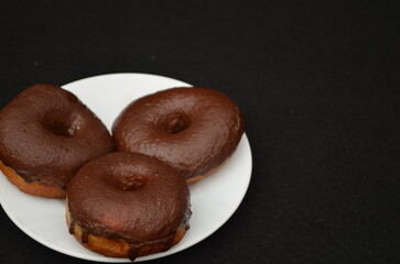 Beautiful handmade donuts covered in chocolate and sugar
