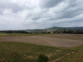 Fototapeta premium Beautiful scenery of the country town of Killarney in Queensland, Southern Downs Region, showing houses, fields, grass and mountains