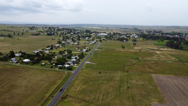 Beautiful scenery of the country town of Killarney in Queensland, Southern Downs Region, showing houses, fields, grass and mountains