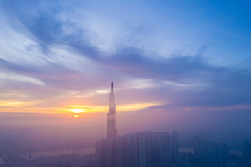 aerial view of Ho Chi Minh City in the morning, Top view aerial photo from flying drone of a Ho Chi Minh City with development buildings, transportation, energy power infrastructure.