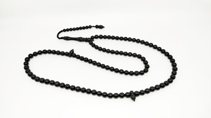 Mate black onyx prayer beads tasbih on a white background 