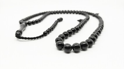 Mate black onyx prayer beads tasbih on a white background 