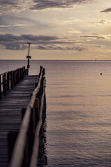 Fototapeta premium pier in the sea sunrise 