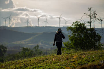 Group of windmills for renewable electric energy production. Wind turbines farm on mountains in rural areas. The clean energy system in Khao Kho District, Phetchabun, Thailand, Southeast Asia.
