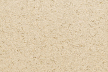A sheet of brown decorative fibrous cardboard texture as background

