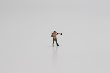 a close up of a miniature figure of a photographer