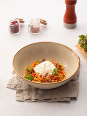 Portion of gourmet spaghetti pasta arrabbiata with roast beef