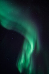green aurora borealis over the sky