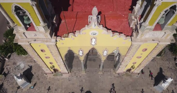 Exterior Decorated Facade Wall of Basilica Cathedral of Mazatlan Mexico, Colorful Baroque Architectural Style of Religious Site Building, Aerial Top Down Rising Up View