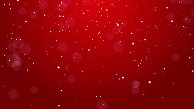 Animated background with red gradient and glittering falling light particles. Snow particles on red background for christmas