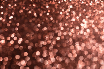 Pink glittering background for design and free space.