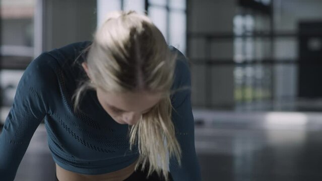 Low angle view of dancer in studio practicing then falling and recovering / Lehi, Utah, United States