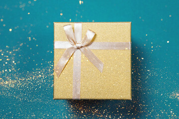 Golden gift box on a blue background.