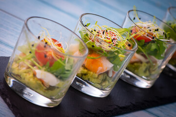 Avocado, shrimp, arugula, mayonaise, espelette pepper and lemon, leek sprouts recipe. High quality photo