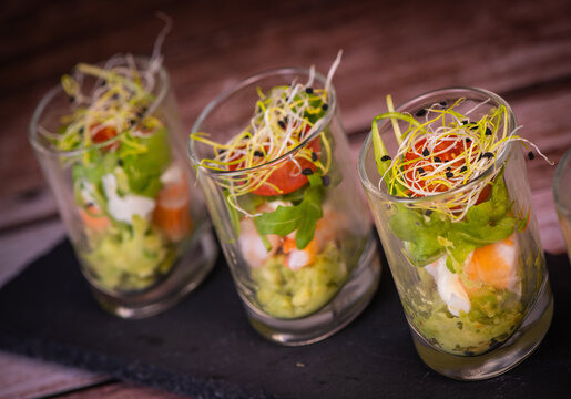 Avocado, shrimp, arugula, mayonaise, espelette pepper and lemon, leek sprouts recipe. High quality photo