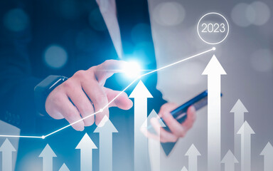 Businessman pointing arrow graph . Business development to success analysing data to increase sales...