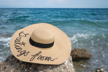 Close up of beach female hat with writing 