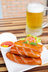 Fried sausages with beer