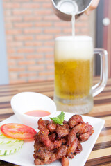 Pork sun-dried is an ancient food of Thailand The ingredients are ground salt or ground pepper, mixed together. Then take it to the sun and fry it. Eat with sticky rice or steamed rice. Or beer