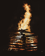 burning fire in the dark, a big bonfire made with logs