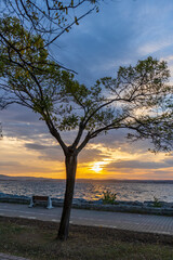 Amazing sunrise view with natural clouds. Morning sun with beautiful colors