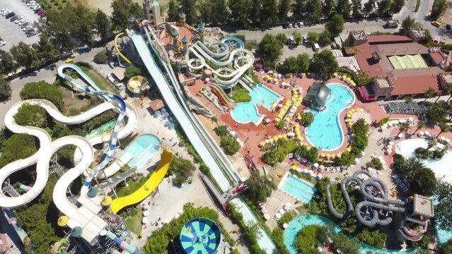 Top view of water park. Aqua park and swimming pools . View from above. High quality 4k footage