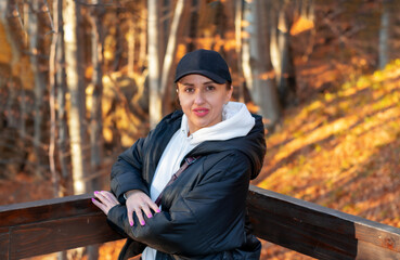 A woman on a walk in the forest in the Ukrainian Carpathians.