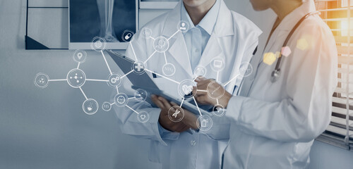Medicine doctor using digital healthcare and network connection on hologram modern virtual screen...