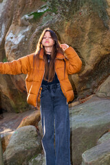 A teenage girl on a walk in the forest in the Ukrainian Carpathians.