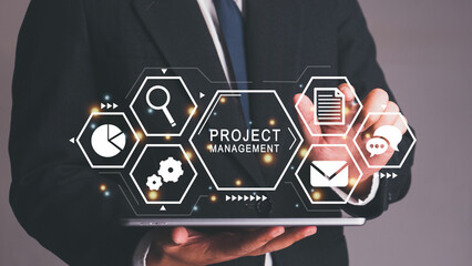 Management diagram on tablet screen with person coordinating teamwork. Project manager working on...