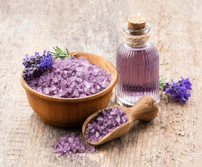 Fototapeta na wymiar Lavender salt and flavored water on wooden backgrounds.
