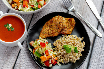 Dinner with tomato soup and salad