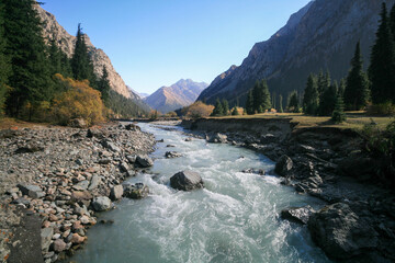 Karakol mountain river on an autumn day, Kyrgyzstan.
